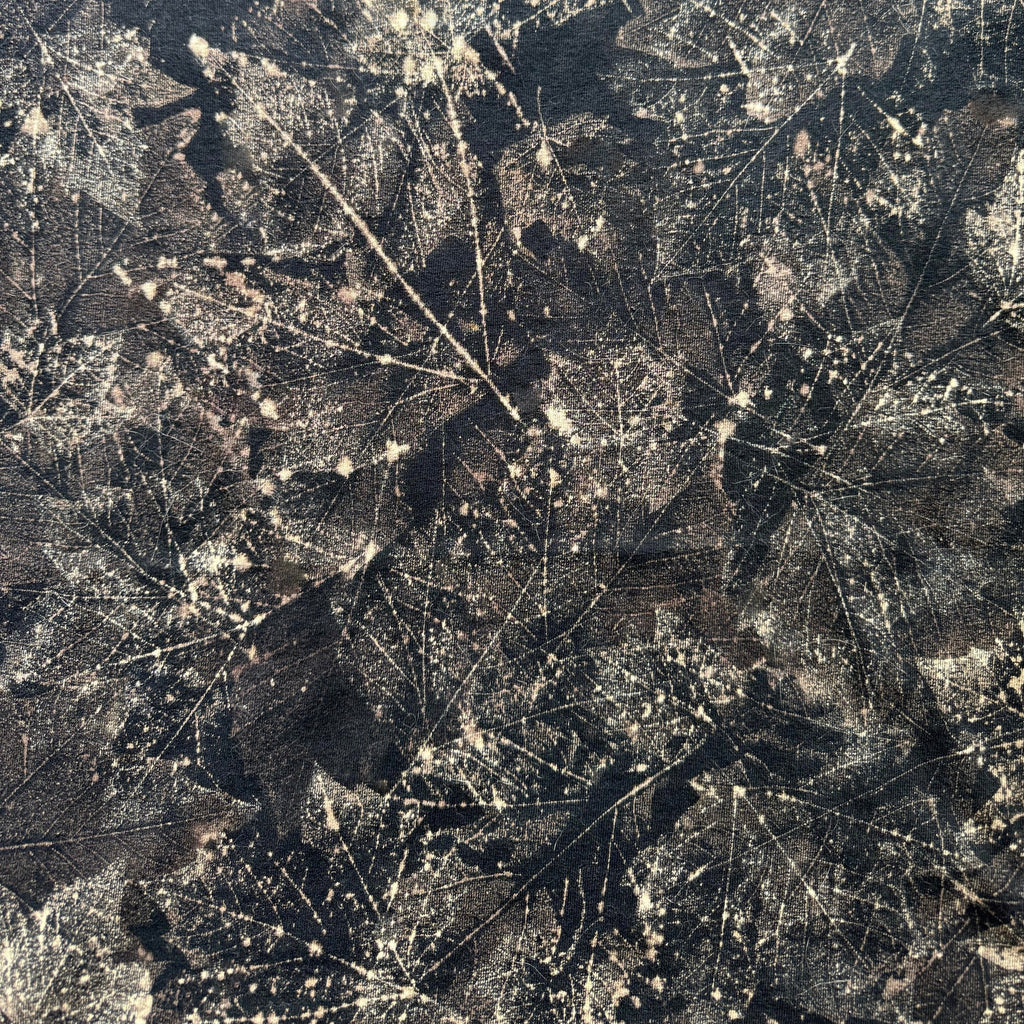 Close-up of a textured surface with leaf patterns
